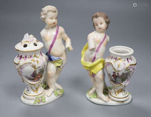 A pair of 18th century Meissen figures of putti and vases, h...