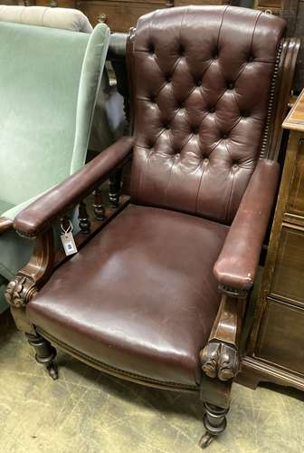 An early Victorian burgundy leather library chair, width 68c...