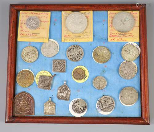 A group of Indian silver and base metal temple tokens or cha...