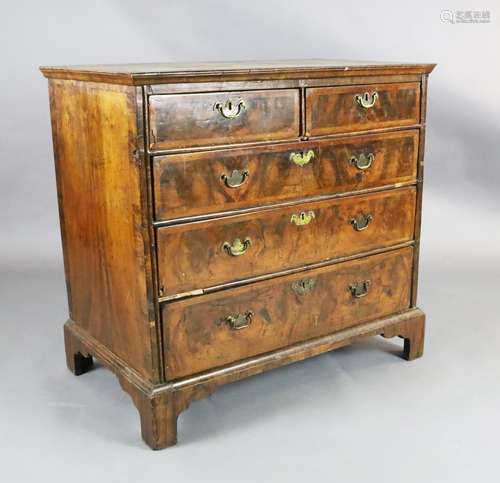 A George III featherbanded walnut chest of two short and thr...