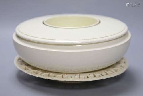 A Wedgwood creamware keywork dish and a hotwater ring shaped...