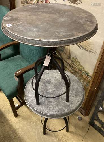 A pair of industrial style circular metal and wrought iron o...