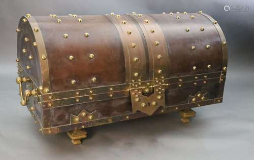 An ormolu and brass mounted leather dome top coffer, with bo...