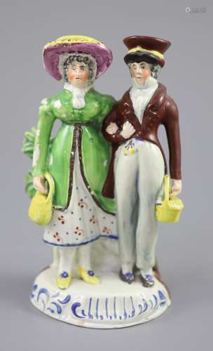 A Staffordshire pearlware group of a Dandy and Dandizette, c...