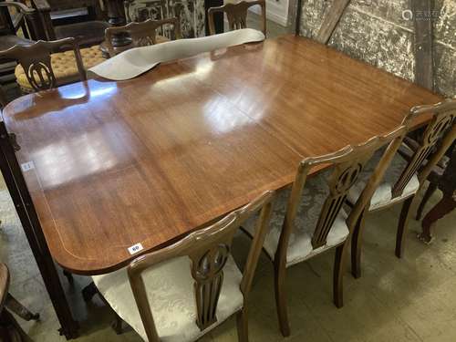 A Regency style mahogany two pillar extending dining table, ...