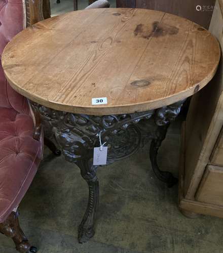 A Victorian cast iron pine top tavern table, 67cm diameter, ...