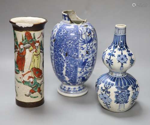 A Chinese blue and white gourd vase, a famille rose sleeve v...