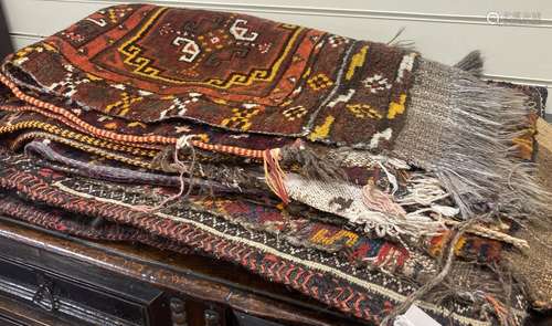 Six Caucasian design mats and a saddlebag, largest 140 x 60c...