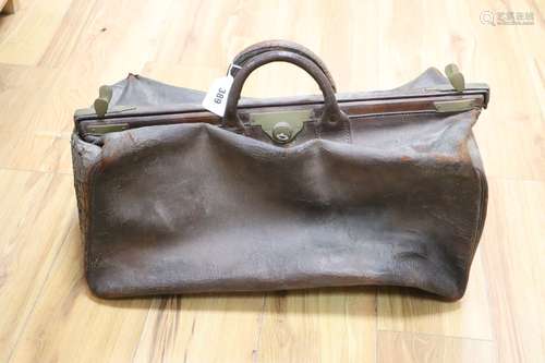 A leather Gladstone bag