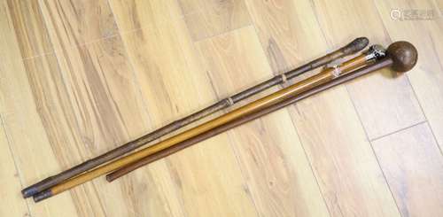 A sword stick, a knobkerrie and an agate mounted cane