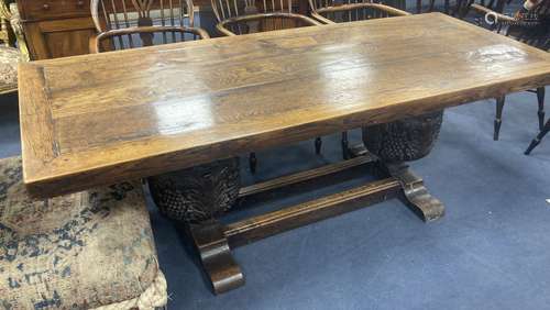 An oak refectory table, the top (formerly a door), length 20...