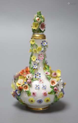 A rare mid 19th century Derby flower encrusted scent bottle,...