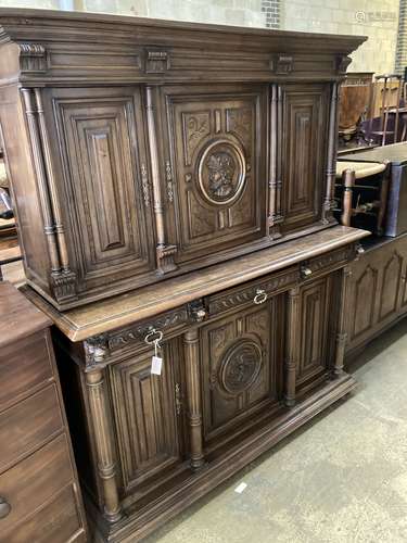 An early 20th century Flemish carved walnut cabinet, width 1...