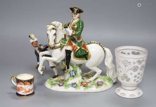 A Continental porcelain figure group, an overlaid glass gobl...