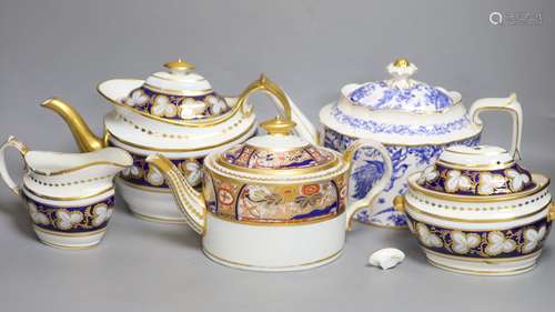 Three various porcelain teapots, a cream jug and a sucrier