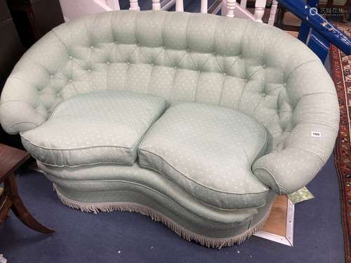 A tub framed two seater settee upholstered in patterned pale...