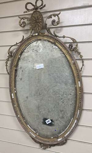 An oval giltwood and gesso wall mirror, width 50cm, height 9...