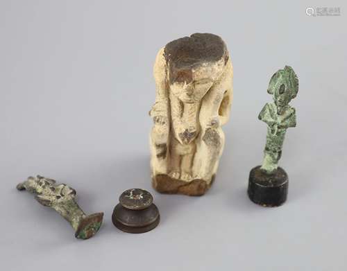 Two Egyptian bronze statuettes of Osiris and a sculpted lime...