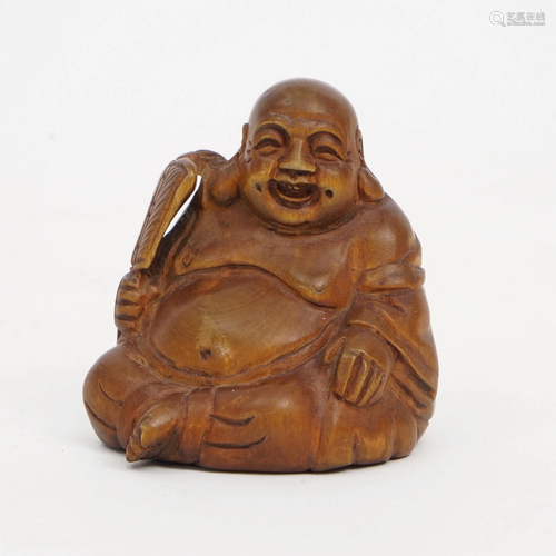 A BOXWOOD BUDDHA STATUE