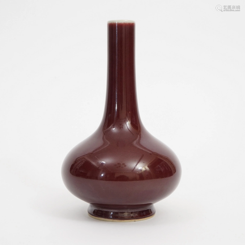 A RED GLAZED WATER CHESTNUT SHAPED VASE