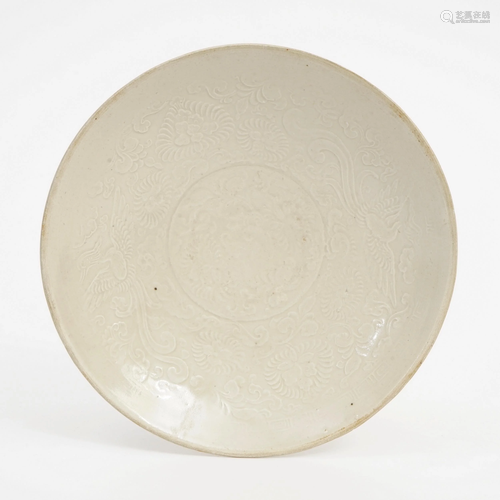 A DING KILN PLATE WITH PHOENIX PATTERN IMPRESSION