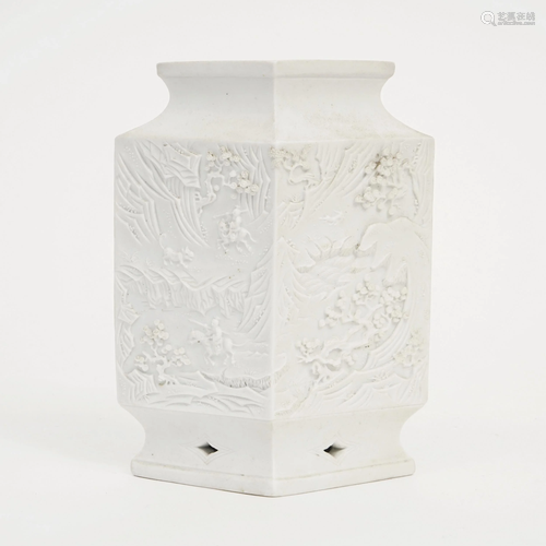 A FLAT CARVED PORCELAIN VASE