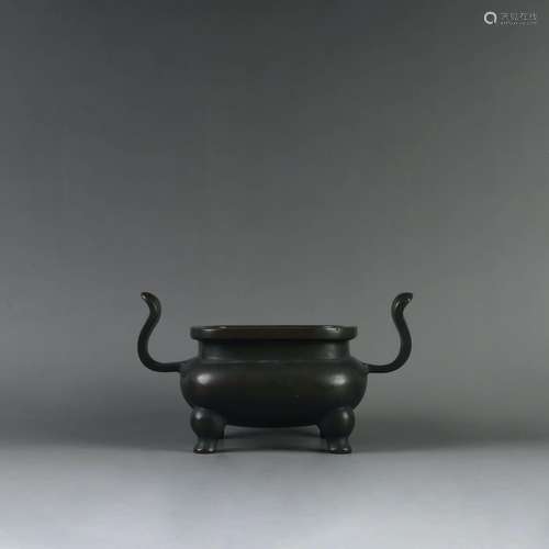 A THREE LEGGED BRONZE INCENSE BURNER