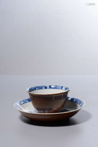 BROWN GROUND BLUE AND WHITE 'FLOWERS' CUP AND SAUCER