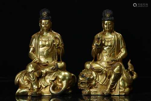 TWO GILT BRONZE CAST MANJUSHRI AND SAMANTABHADRA SEATED FIGU...