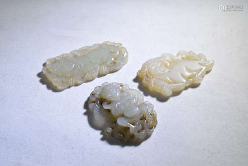 A Group Three Jade Tiger, Lion, Khyung Plates