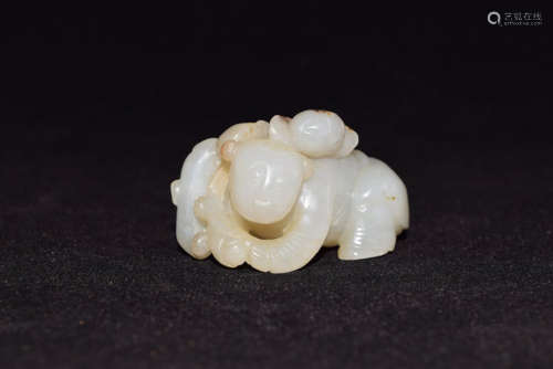 A White Jade Child with Lotus Flower and Beast Figure