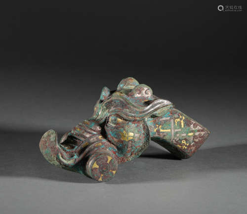 Silvering and gold ornament in dragon form from Han漢代錯金銀...