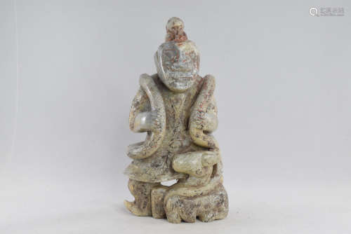 A Jade Man with Snake and Deer Figure Statue