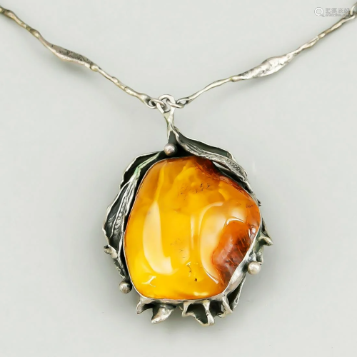 Amber pendant with silver moun