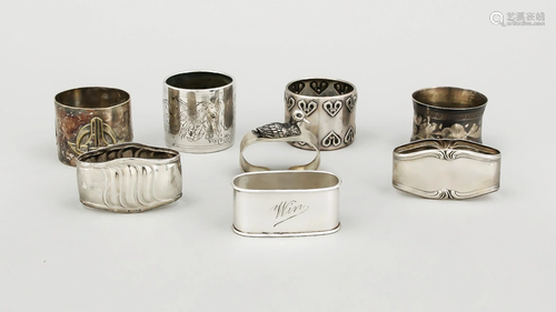 Group of eight napkin rings, a