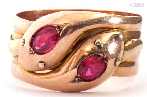 Large 9ct gold ruby set serpent ring, a design featuring two...