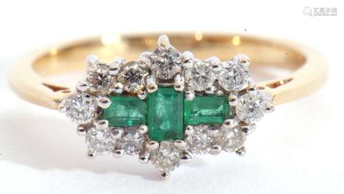 An emerald and diamond cluster ring, centring three small st...