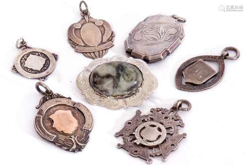 Mixed Lot: four hallmarked silver fobs, a white metal exampl...