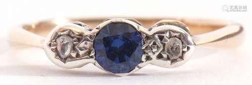 Sapphire and diamond three stone ring centring a small round...