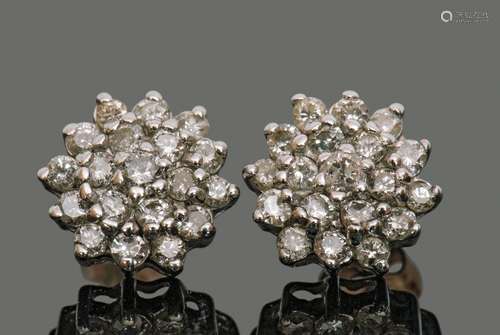 Pair of diamond cluster earrings, each featuring 19 small si...