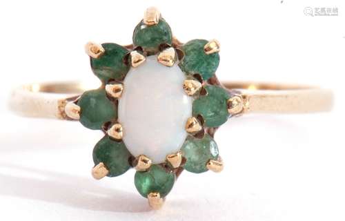 Modern 9ct gold opalescent and emerald cluster ring, the ova...