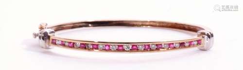 9ct gold ruby and diamond hinged bangle, the top section alt...