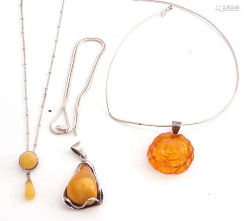 Mixed Lot: pressed amber pendant on a 925 marked bale on a c...