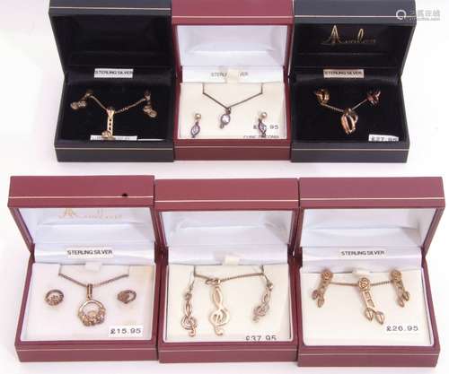 Mixed Lot: six white metal necklace and matching earring set...