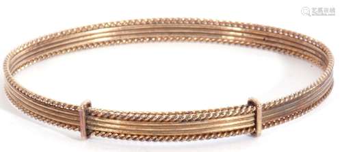 9ct gold expandable bangle, oval shaped with a reeded frame ...