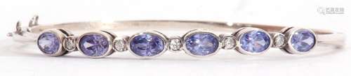 Modern pale sapphire and diamond set hinged bracelet, featur...