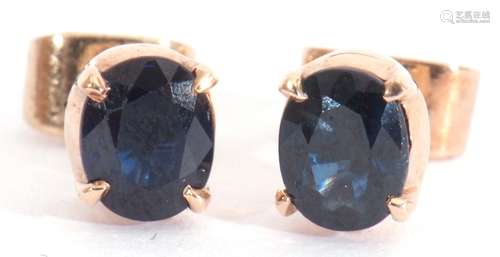 Pair of single stone small sapphire stud earrings in yellow ...