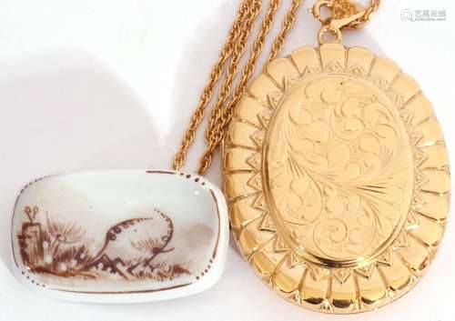 Large gold plated oval locket on a 925 stamped chain togethe...