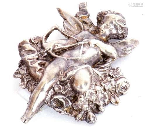 Vintage white cast metal brooch depicting Cupid and his bow ...