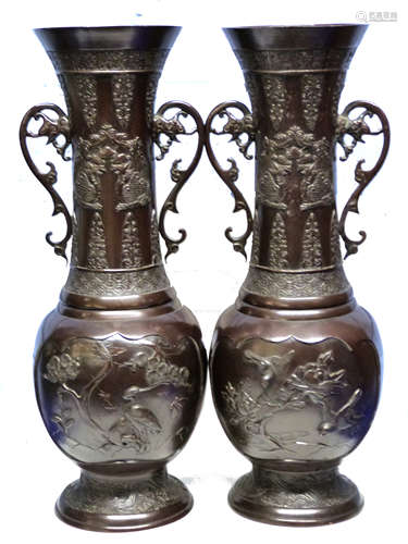 Pair of Japanese bronzed spelter vases decorated in Meiji st...